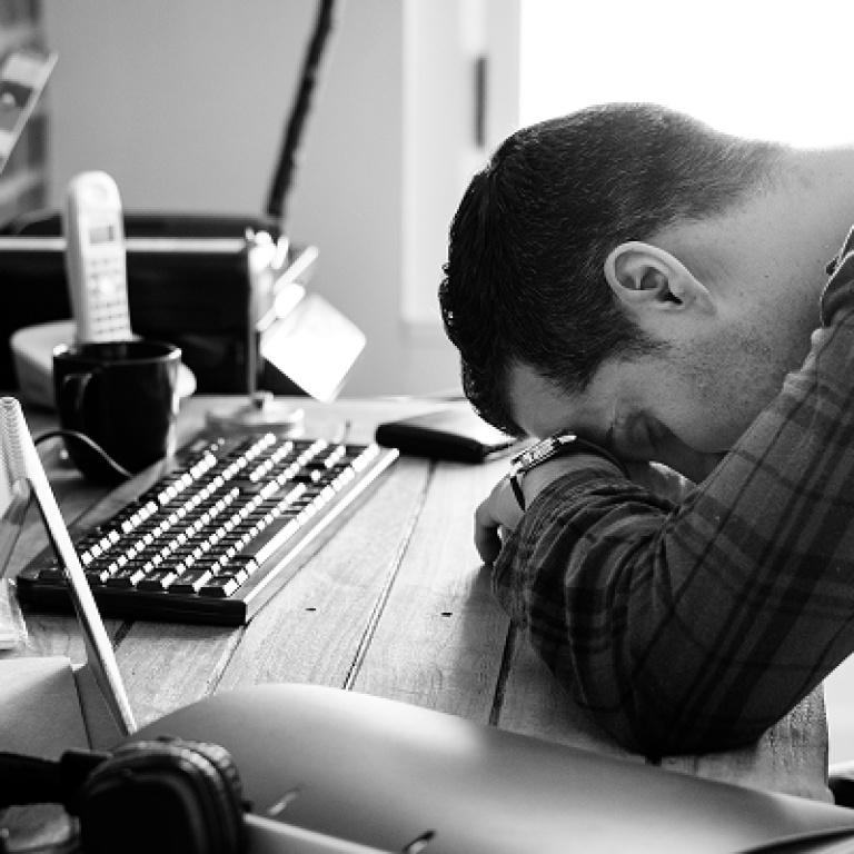 tired-man-napping-working-desk 1